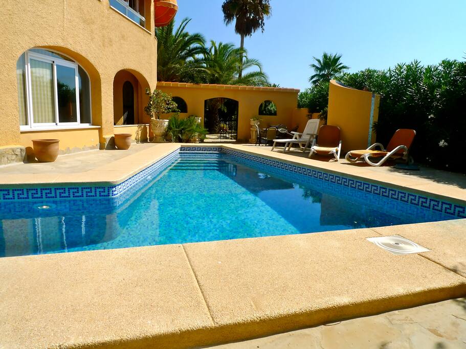 Go through the archway and around the corner to the small apartment!