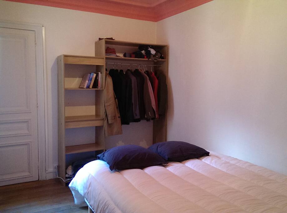 Bedroom number one with a large Queen Size Bed and a closet. The Bedroom is very quiet.
