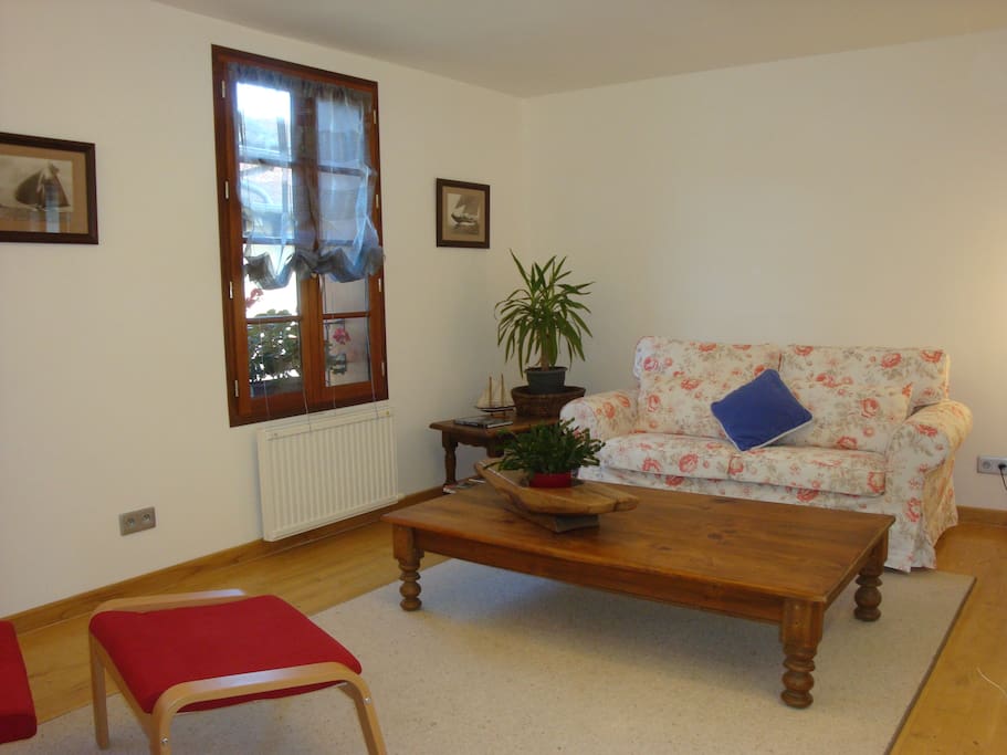 living room with double sofa and arm chair