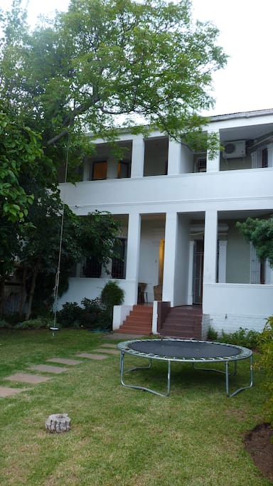 This shows our house (entrance to your left) and the neighbours to your right. The garden is shared between us, with due consideration given to one another.