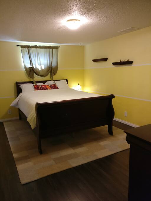 148 sq ft. Bedroom with Queen bed and locking door