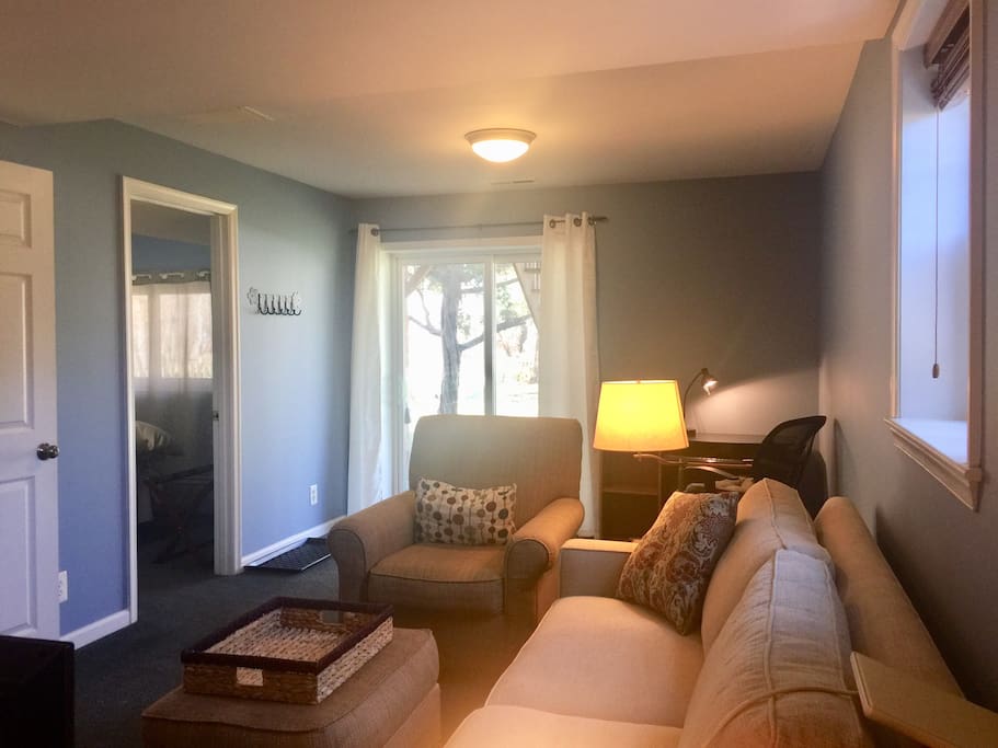 The living room from the other direction showing the sliding glass door entrance.