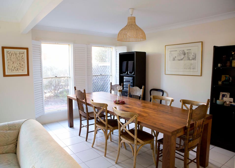 Beautiful long dinning table perfect for sharing meals with family and friends.