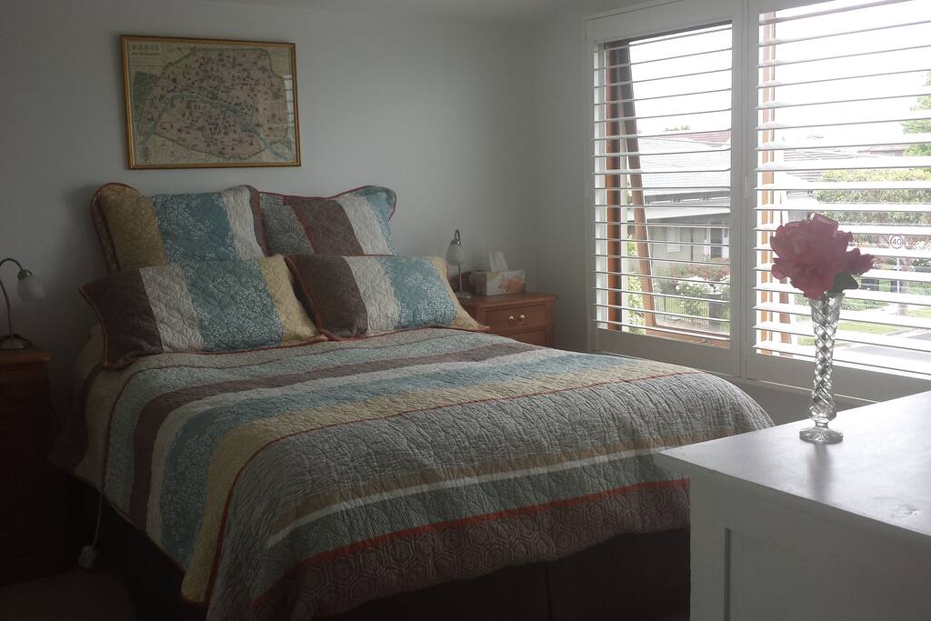 Queen-size bed in separate bedroom, you can see the view out across the bay from your bed!