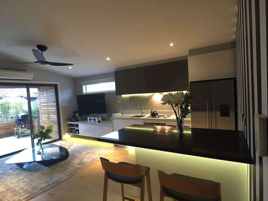 Open plan kitchen/breakfast bar/lounge which flows out onto the terrace with full bbq