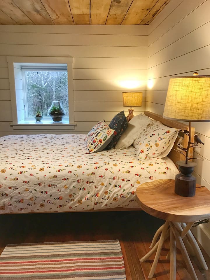 The "Nature" bedroom, fresh and comfy linens and beds