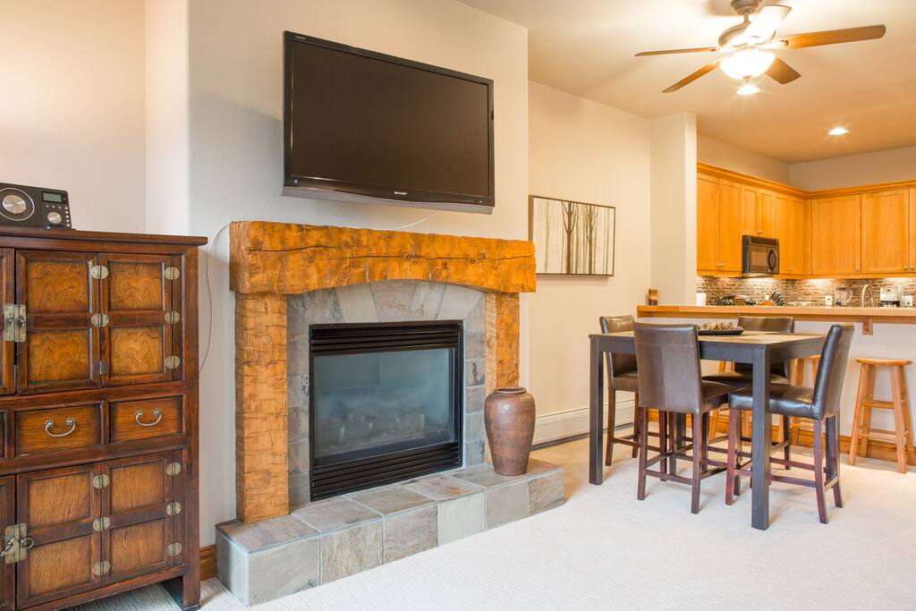 living room with large, retractable flatscreen TV