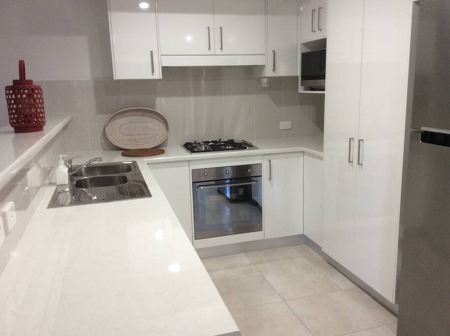 Fully finctionalkitchen with dishwasher, microwave, full size fridge/freezer, gas cooking with electric oven.