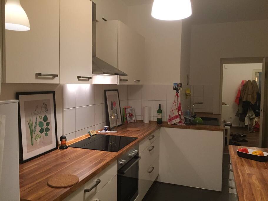 Well furnished kitchen with a sunny balcony onto the inner yard.
