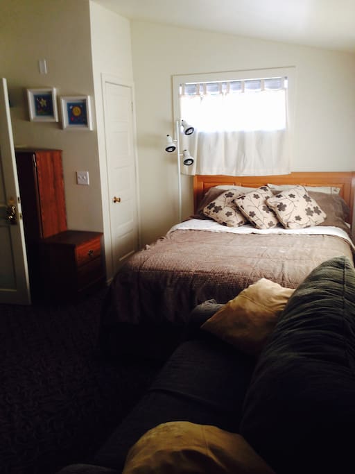 Comfy queen bed and storage area