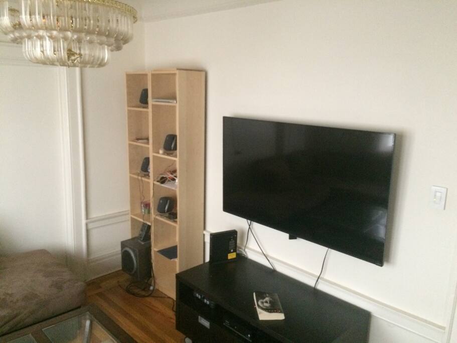 60 inch TV with premium channels and basic sports package.