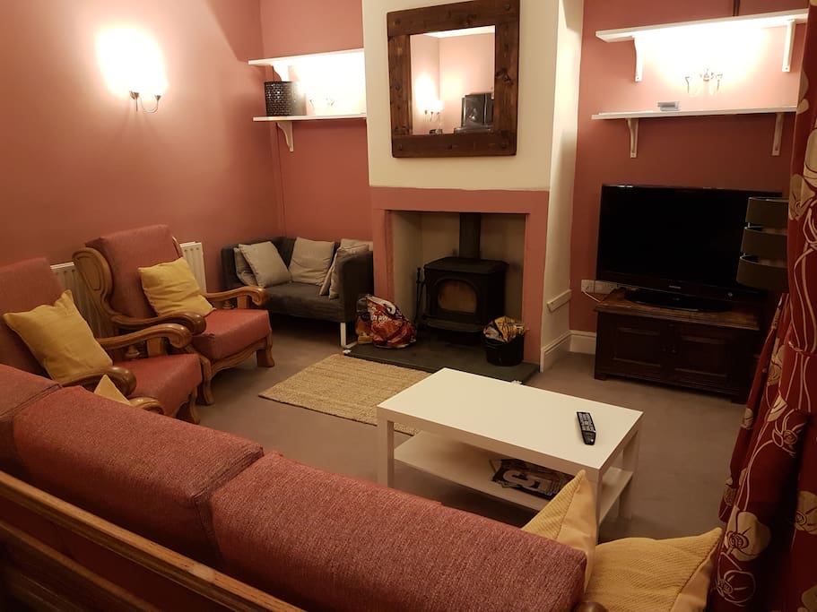 Lounge complete with multi-fuel stove and smart tv