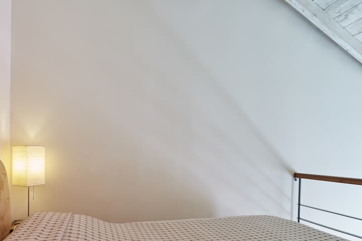 comfortable double bed on mezzanine