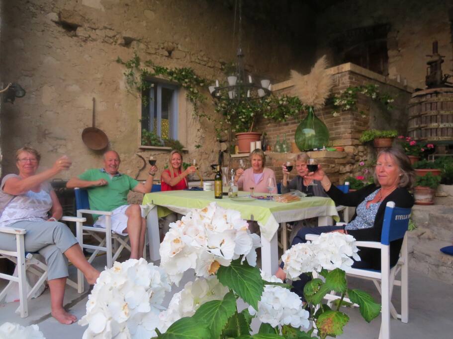 Guests enjoying good company food and wine