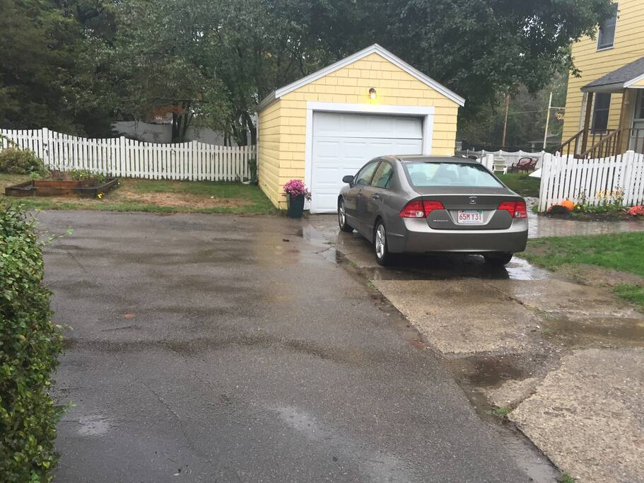 3 cars can fit easily with each able to come and go. Driveway can hold 5, though.
