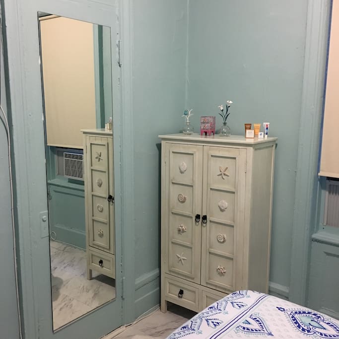 Full length mirror and accent chest.