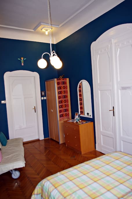 Blue bedroom with queen sized bed - this room can sleep up to 4 people