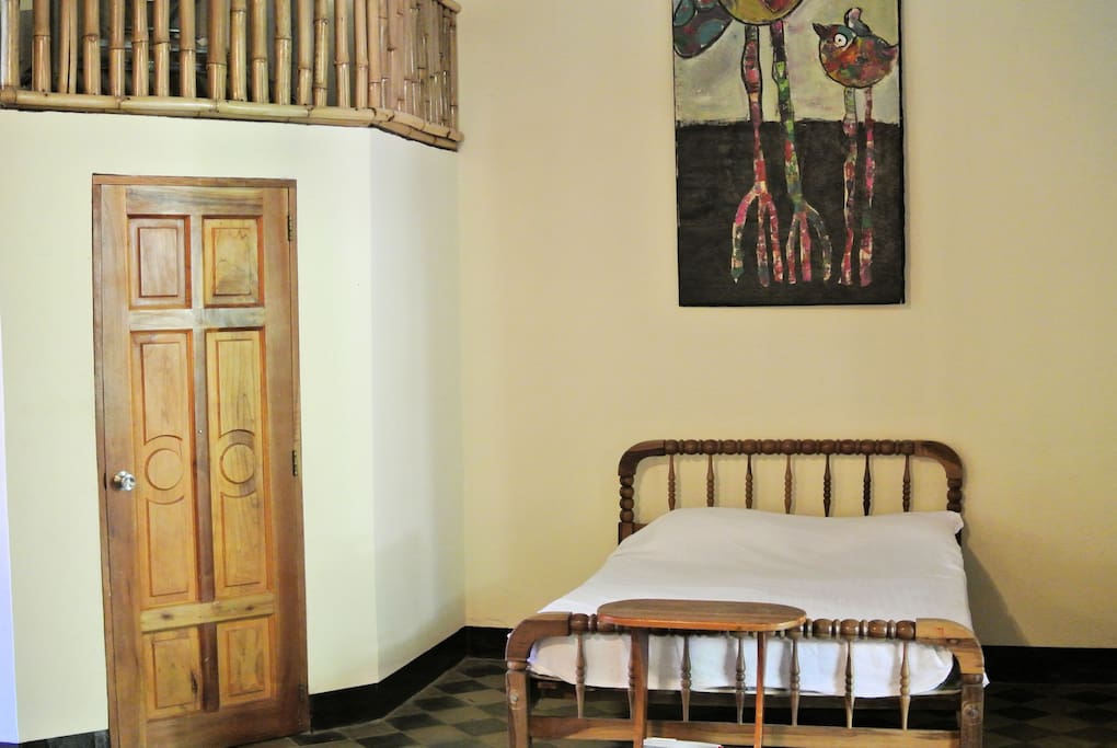 Full size bed near en suite bathroom