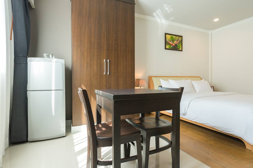 Comfortable king size bed with working desk.