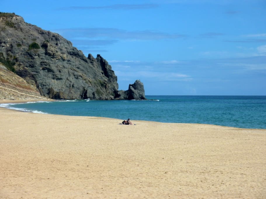 The beach with iconic Black Rock at it`s end