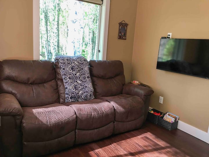 Enjoy your favorite TV shows on very comfortable reclining leather couch. Use the Roku satellite TV or sign into your own Netflix/Amazon Prime or any other subscription service.