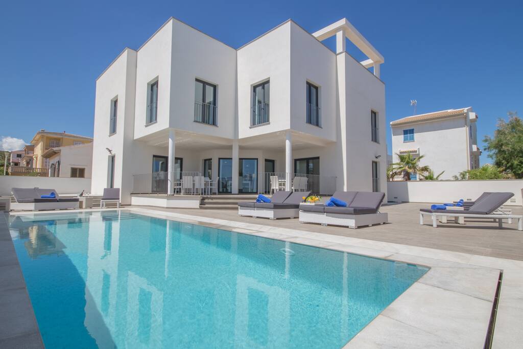 Pool area with sun beds