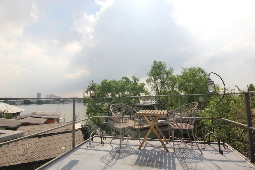 Rooftop sitting area with a view.