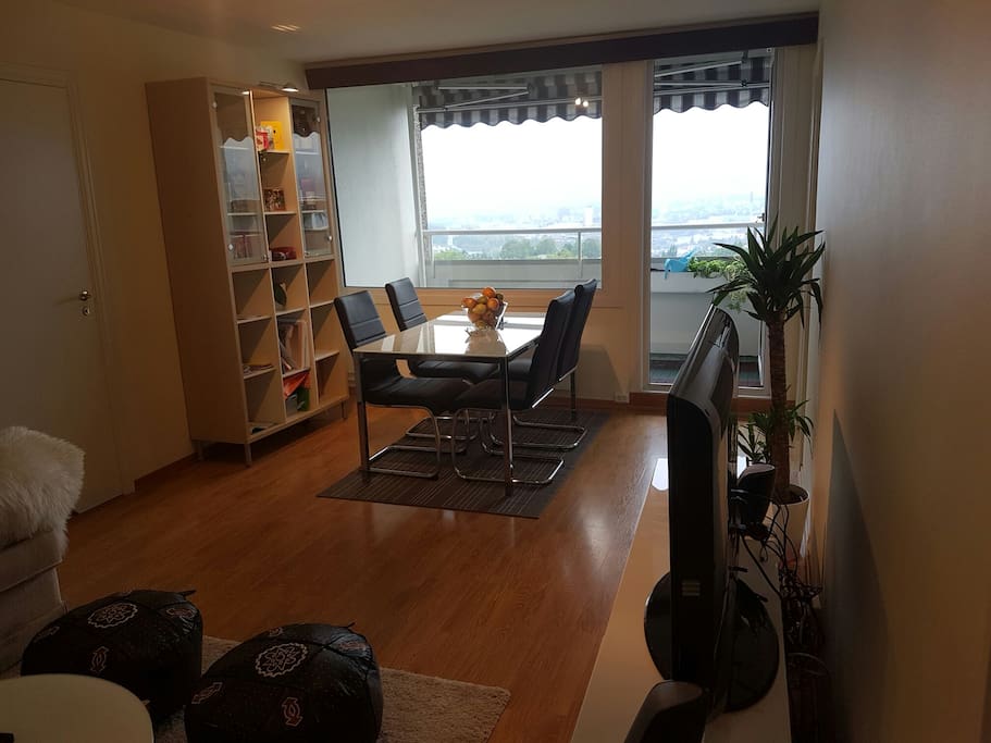 Dining set with fruits and chocolate for you. Storage space, big tv and free wifi.