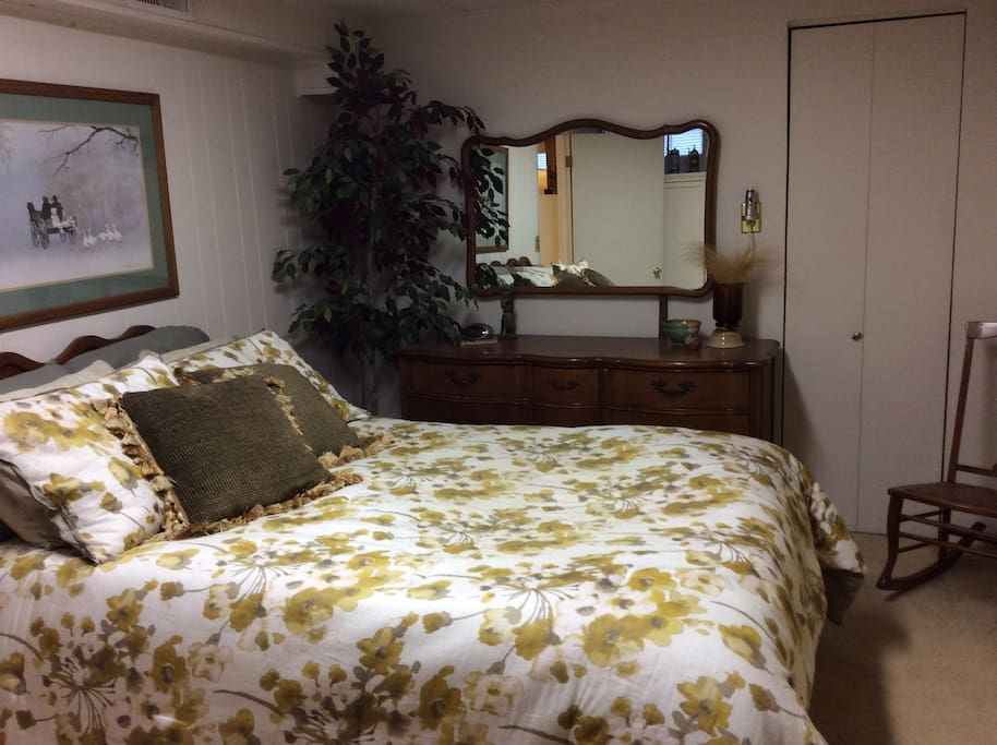 Your bedroom with empty dresser drawers and room to hang clothes in closet. We often change the bedspreads, so that may be different in the picture.