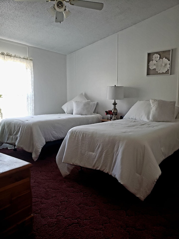 Guest bedroom with two twin beds.