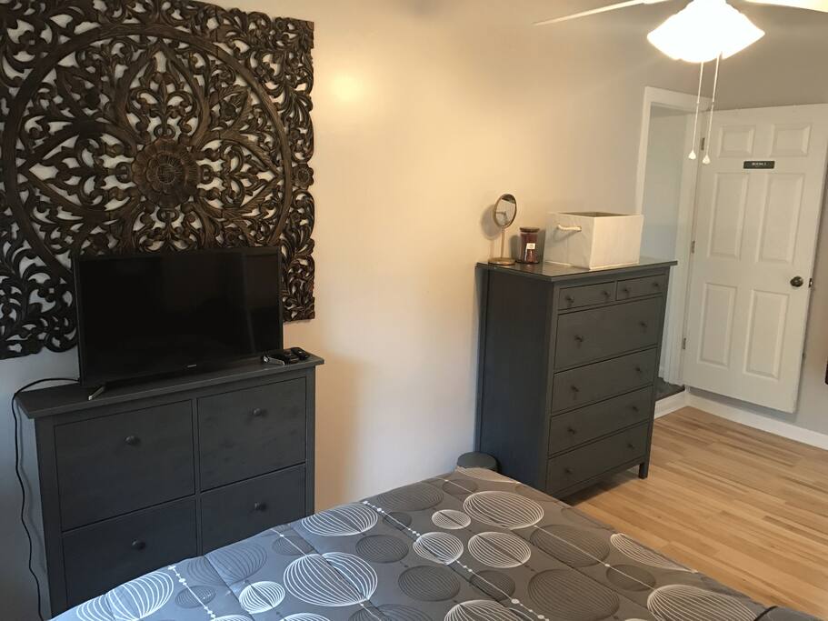 Bedroom 3: 32" Smart TV with Roku, skinny shoe dresser, large dresser with mirror. There's an over the door mirror full length mirror as well.