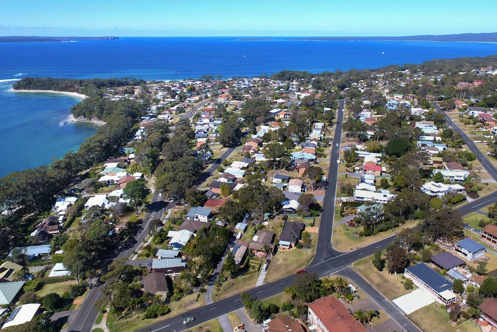 Orion Beach Cottage bottom right corner. This picture highlights the exceptional location the house has on offer. Hyams Beach to the right and Point Perpendicular to the left. Time to explore everything in between. Easy with the coastal walking / cycle path less the 5 mins walk.