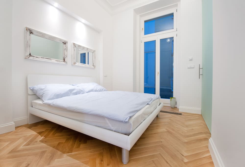 Comfortable double-bed with provided linens.