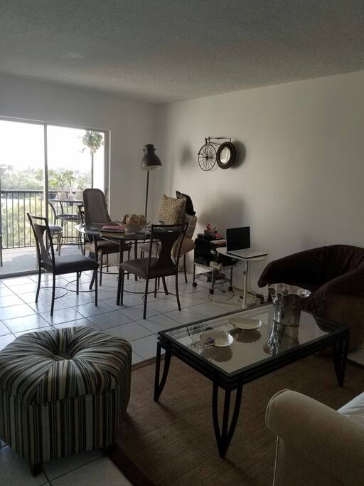 Living room, dining room & furnished balcony