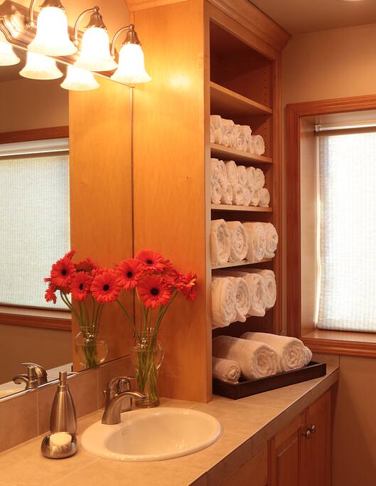 Bathroom with lots of fluffy white towels, two comfy robes and heated tile floor that your toes will love.