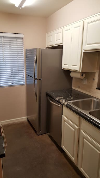 Kitchen with granite counters and stainless appliances