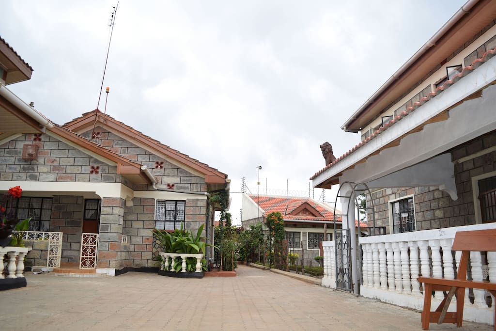 On the right our main house with one double bedroom, one bunkbed room and two double bunkbed rooms, kitchen, one bathroom and two toiletts.All located upstairs with an extra entrance.