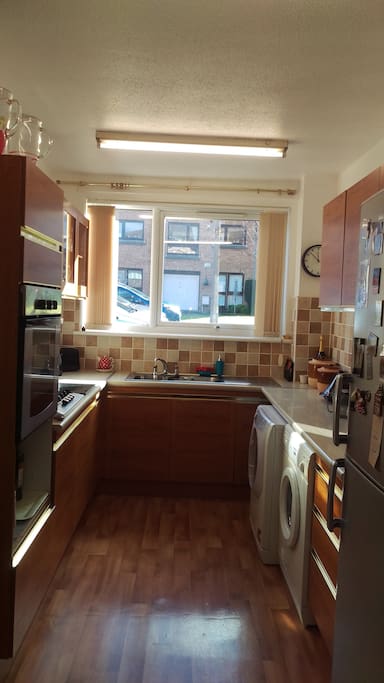 Fully equipped kitchen with spacious dining area