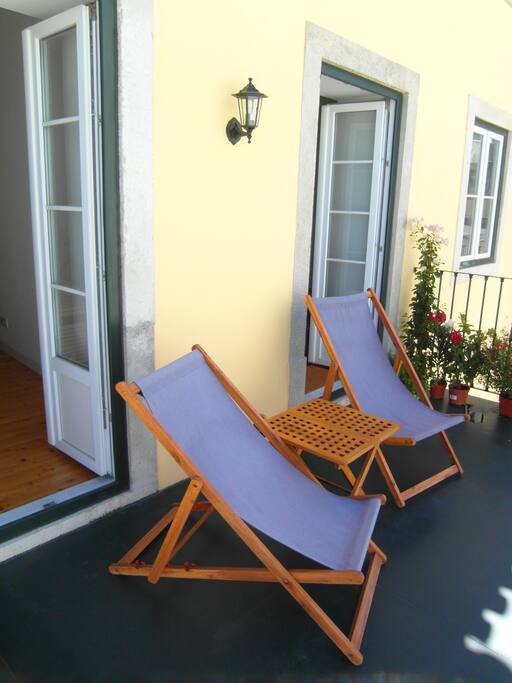 The bedroom and the living room have window-doors opening into the terrace.