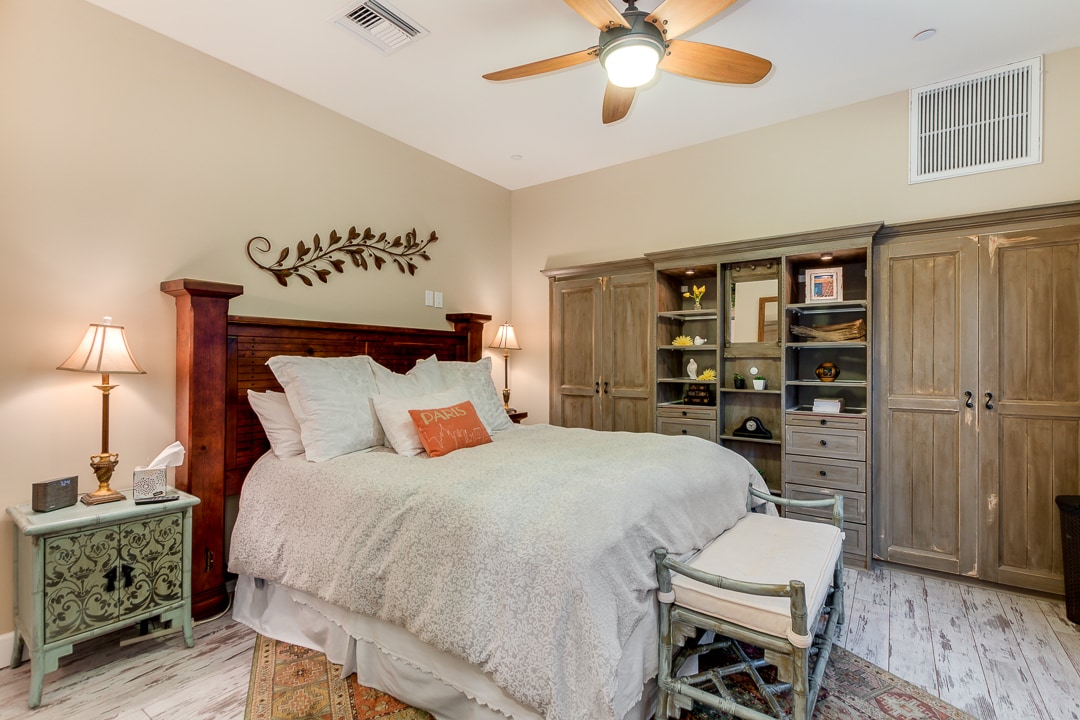 King sized sleep number bed with his and her custom closets.