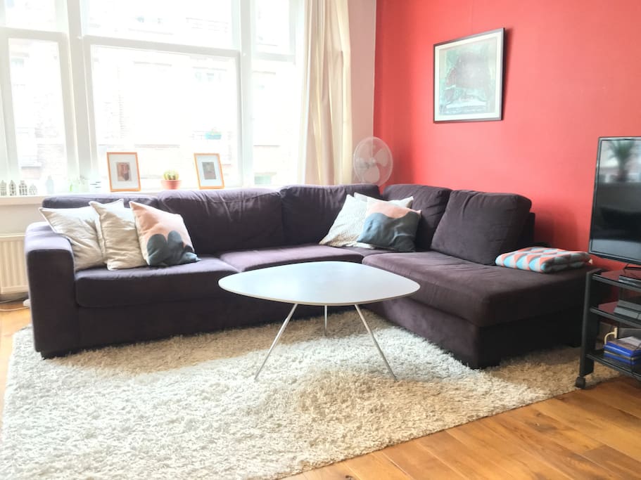 Comfy and sunny living room is perfect for chilling after a long day of sight seeing