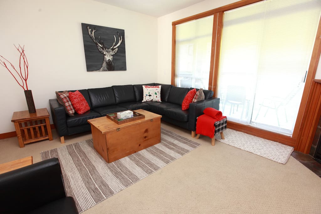 Enjoy movies and mountain vistas from the living room.