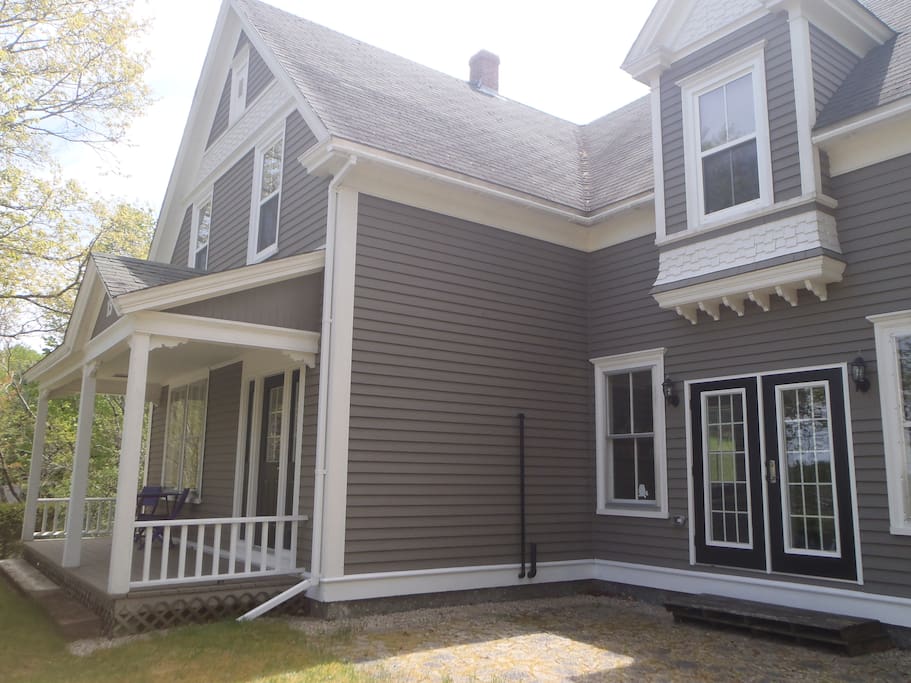 Front view of our home - overlooking the river, surrounded by trees.