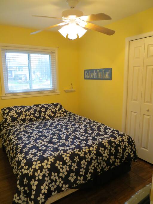 Bedroom with queen bed, closet.