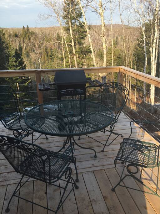 Large deck facing the Baptism River and Tettegouche Park.