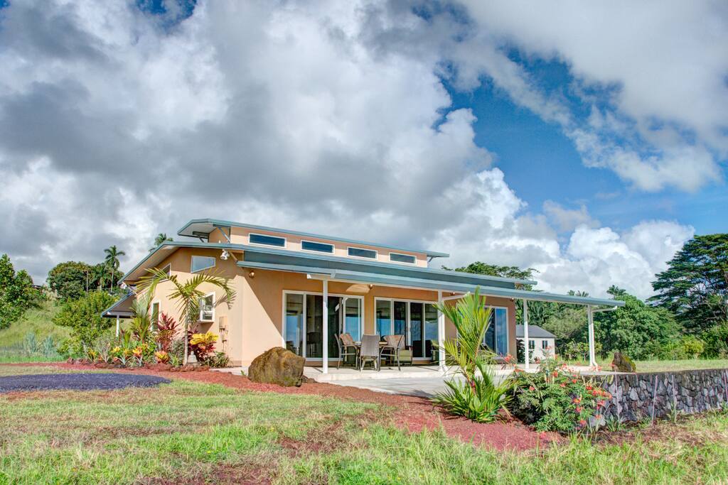 Dine on the lanai with views of orchard and ocean in the distance.