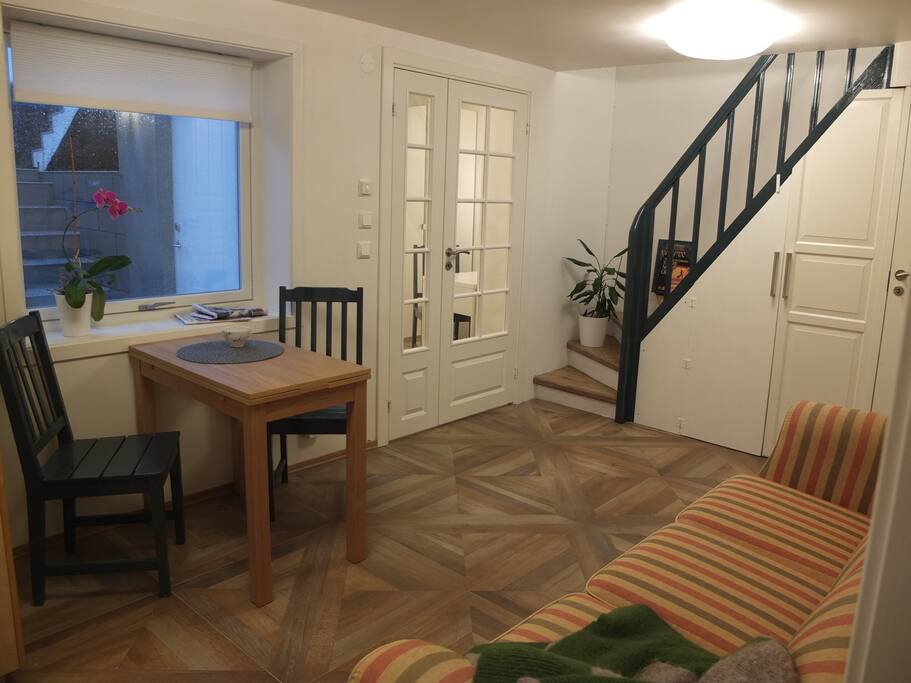 Sofa and table. Note that the stair is behind a door (next photo)