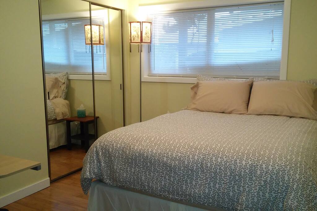 2nd bedroom with comfy pillow top queen bed, computer work station, dresser and ample closet space