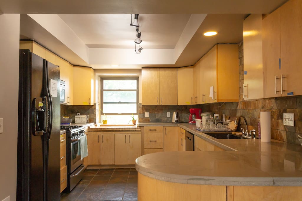 The shared kitchen with ample space for personal food storage.
