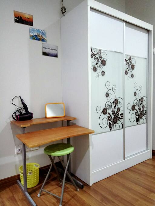 A closet, mirror, hair dryer and table are essential for girls!